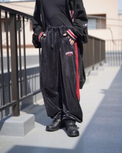 oversized black × red glossy velours track pants