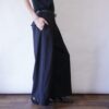 mode black drape fabric pleats tuck wide slacks