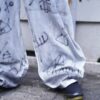 "Wall Paint" ancient motif white baggy remake pants