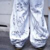 "Wall Paint" ancient motif white baggy remake pants