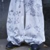 "Wall Paint" ancient motif white baggy remake pants