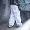 "Wall Paint" ancient motif white baggy remake pants