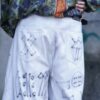 "Wall Paint" ancient motif white baggy remake pants