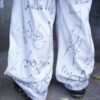 "Wall Paint" ancient motif white baggy remake pants