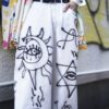 "Wall Paint" prophecy motif white baggy remake pants