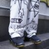 "Wall Paint" prophecy motif white baggy remake pants