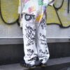 "Wall Paint" prophecy motif white baggy remake pants
