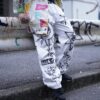"Wall Paint" prophecy motif white baggy remake pants