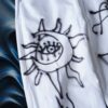 "Wall Paint" prophecy motif white baggy remake pants