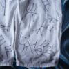 "Wall Paint" ancient motif white baggy remake pants