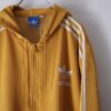 【adidas】 "短丈トラックフーディのリアルボロ" yellow hooded track jacket