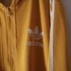 【adidas】 "短丈トラックフーディのリアルボロ" yellow hooded track jacket