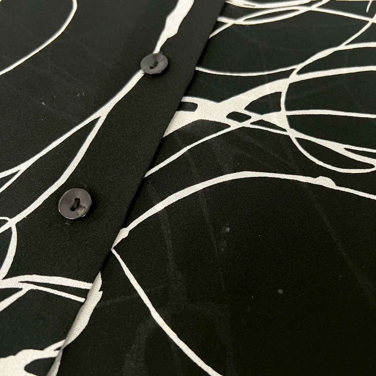 monotone geometric pattern see-through shirt